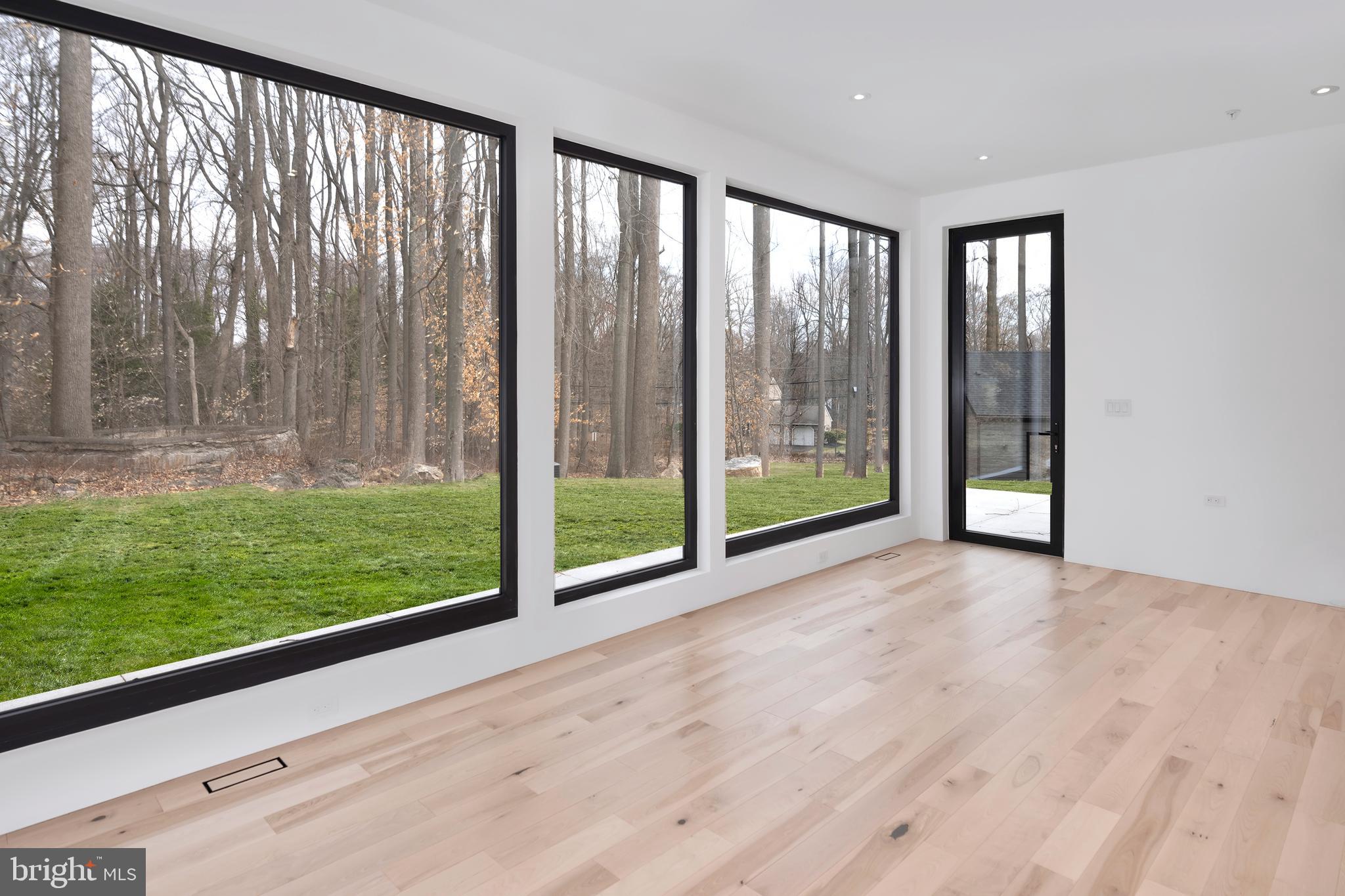 3146 Mill Road Doylestown, PA 18902 - Photo 18 of 33 a view of an empty room with floor to ceiling windows and yard