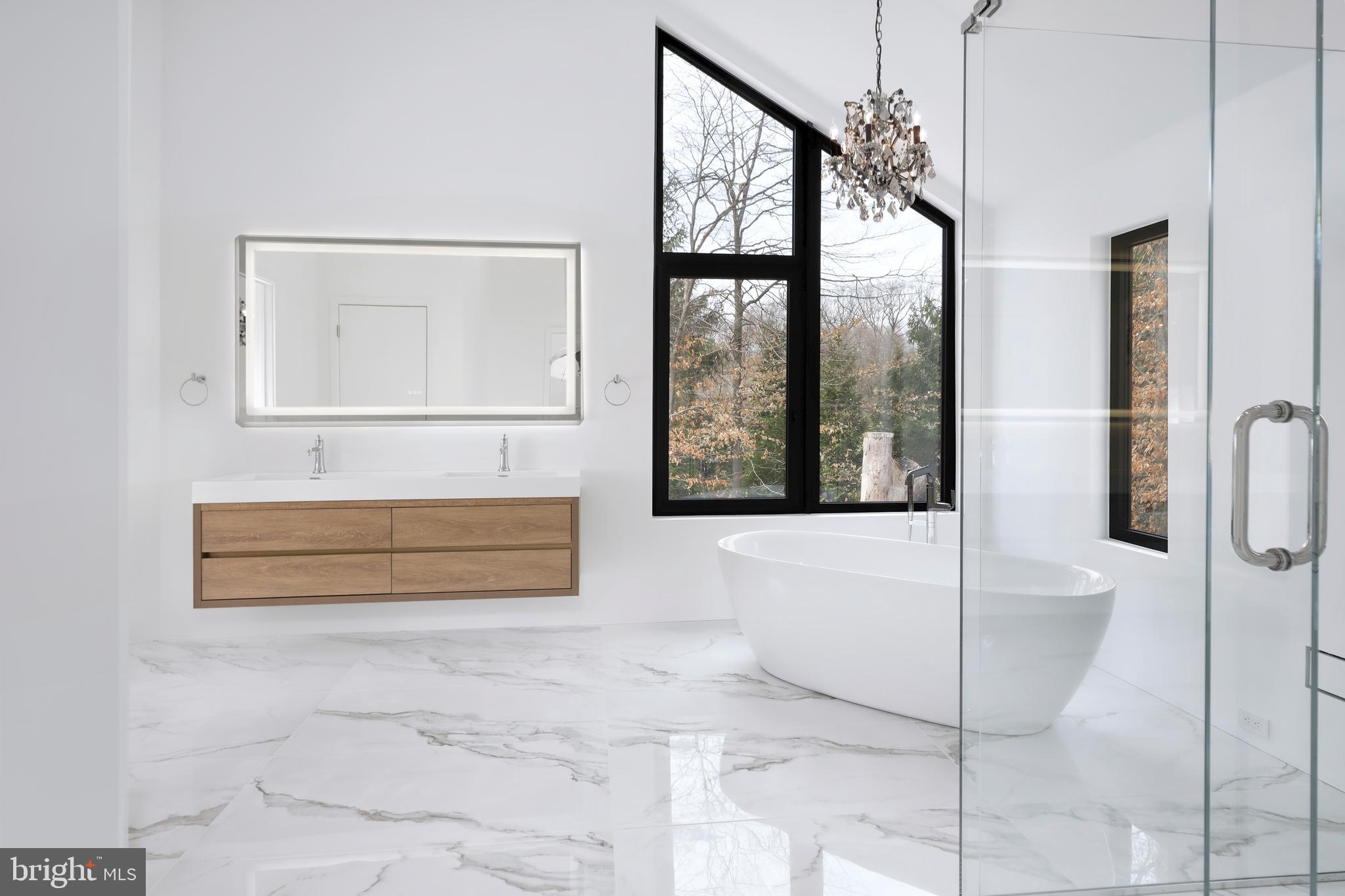 3146 Mill Road Doylestown, PA 18902 - Photo 22 of 33 a bathroom with a bathtub and a shower