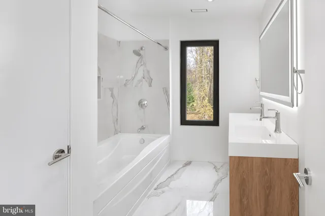 a view of an empty room with windows