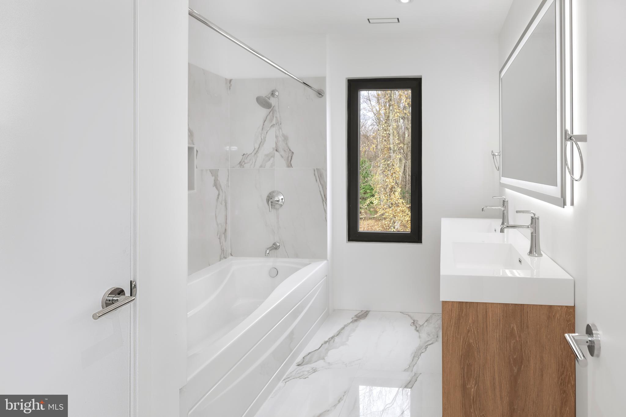 3146 Mill Road Doylestown, PA 18902 - Photo 25 of 33 a bathroom with a bathtub and a sink