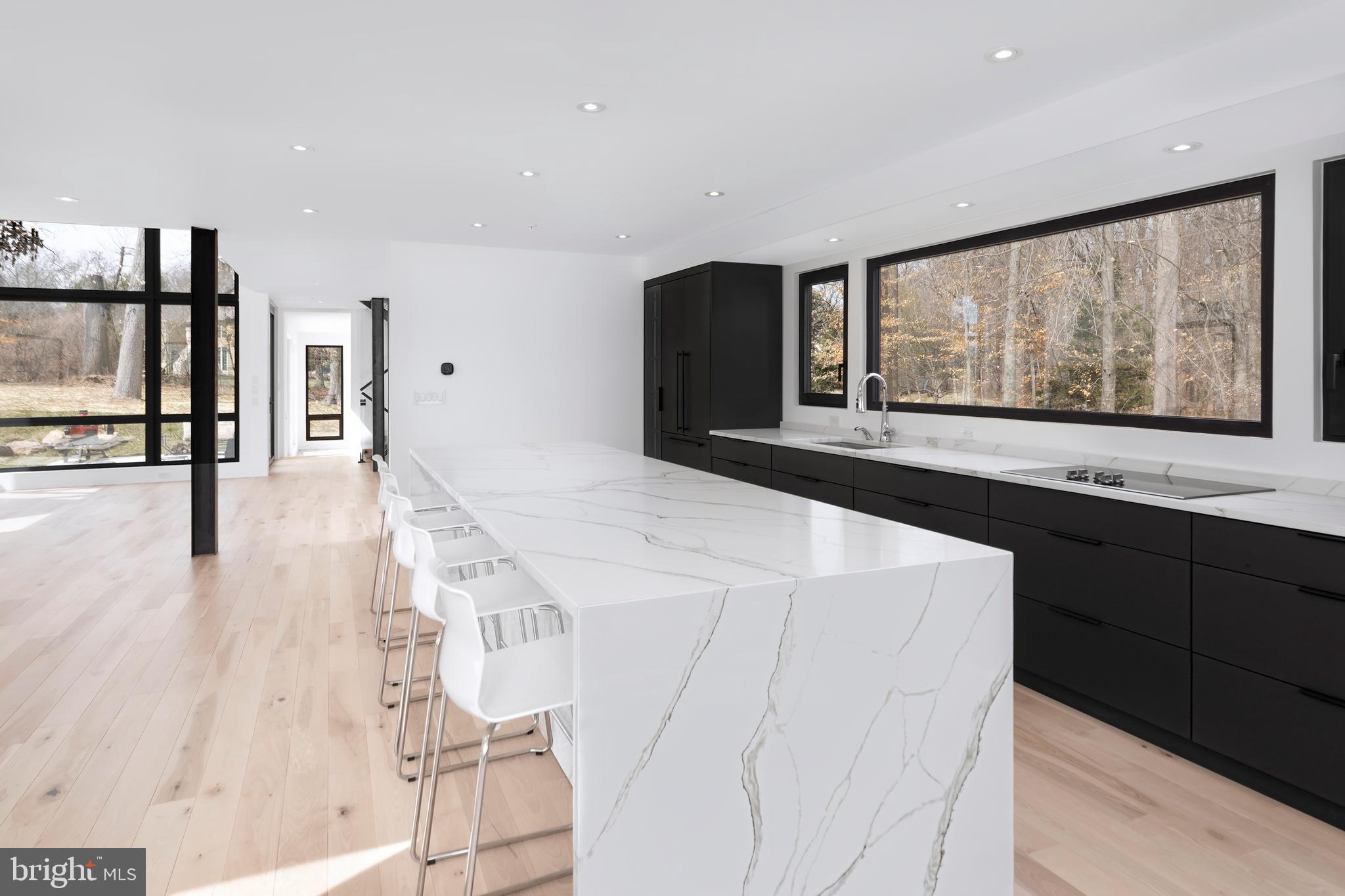 3146 Mill Road Doylestown, PA 18902 - Photo 9 of 33 a kitchen with stainless steel appliances kitchen island wooden cabinets and window