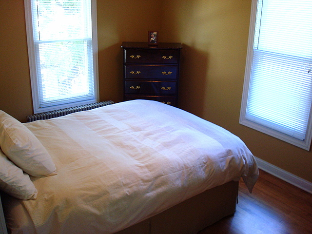 4241 North Springfield Avenue Chicago, IL 60618 - Photo 13 of 19 a bedroom with a bed and a window