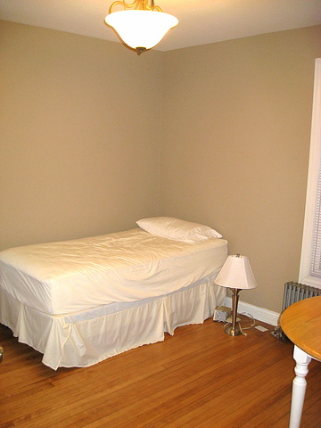 4241 North Springfield Avenue Chicago, IL 60618 - Photo 14 of 19 a bedroom with a bed and a table