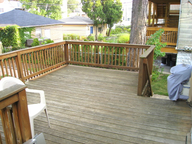 4241 North Springfield Avenue Chicago, IL 60618 - Photo 18 of 19 a view of a balcony with wooden floor