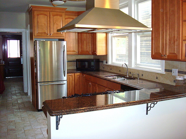 4241 North Springfield Avenue Chicago, IL 60618 - Photo 8 of 19 a kitchen with a sink a refrigerator and cabinets