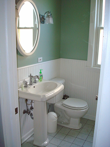 4241 North Springfield Avenue Chicago, IL 60618 - Photo 10 of 19 a bathroom with a toilet a sink and a mirror