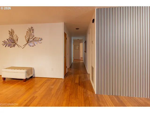 a view of a room with wooden floor