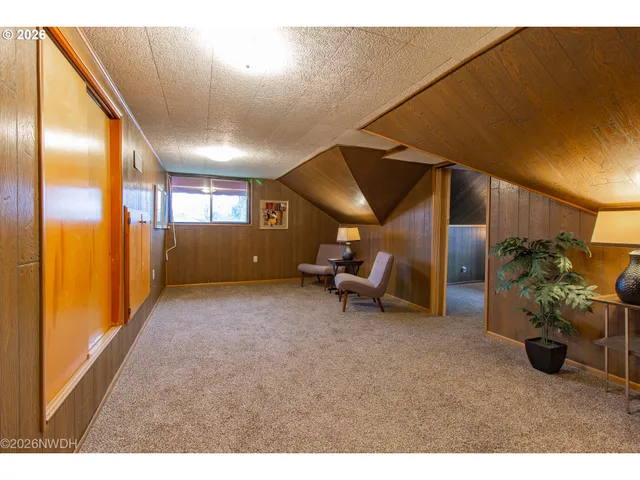 a view of a livingroom with furniture and a garage