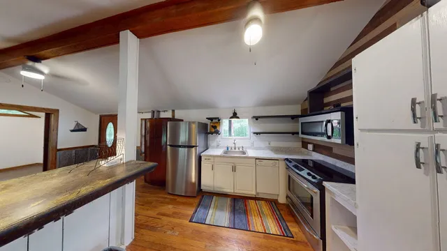a view of stairs with wooden floor