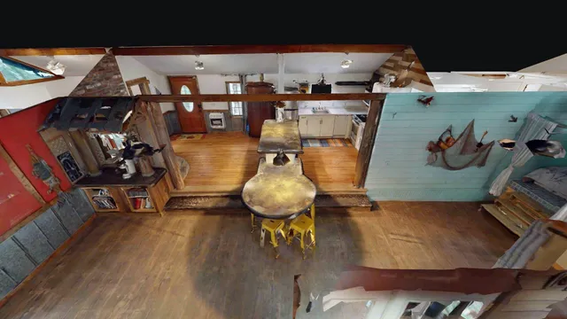 a view of backyard with large trees and wooden fence