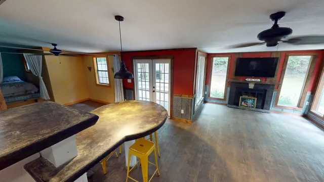 a dining room with furniture and window