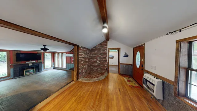 a view of livingroom with furniture workspace and window
