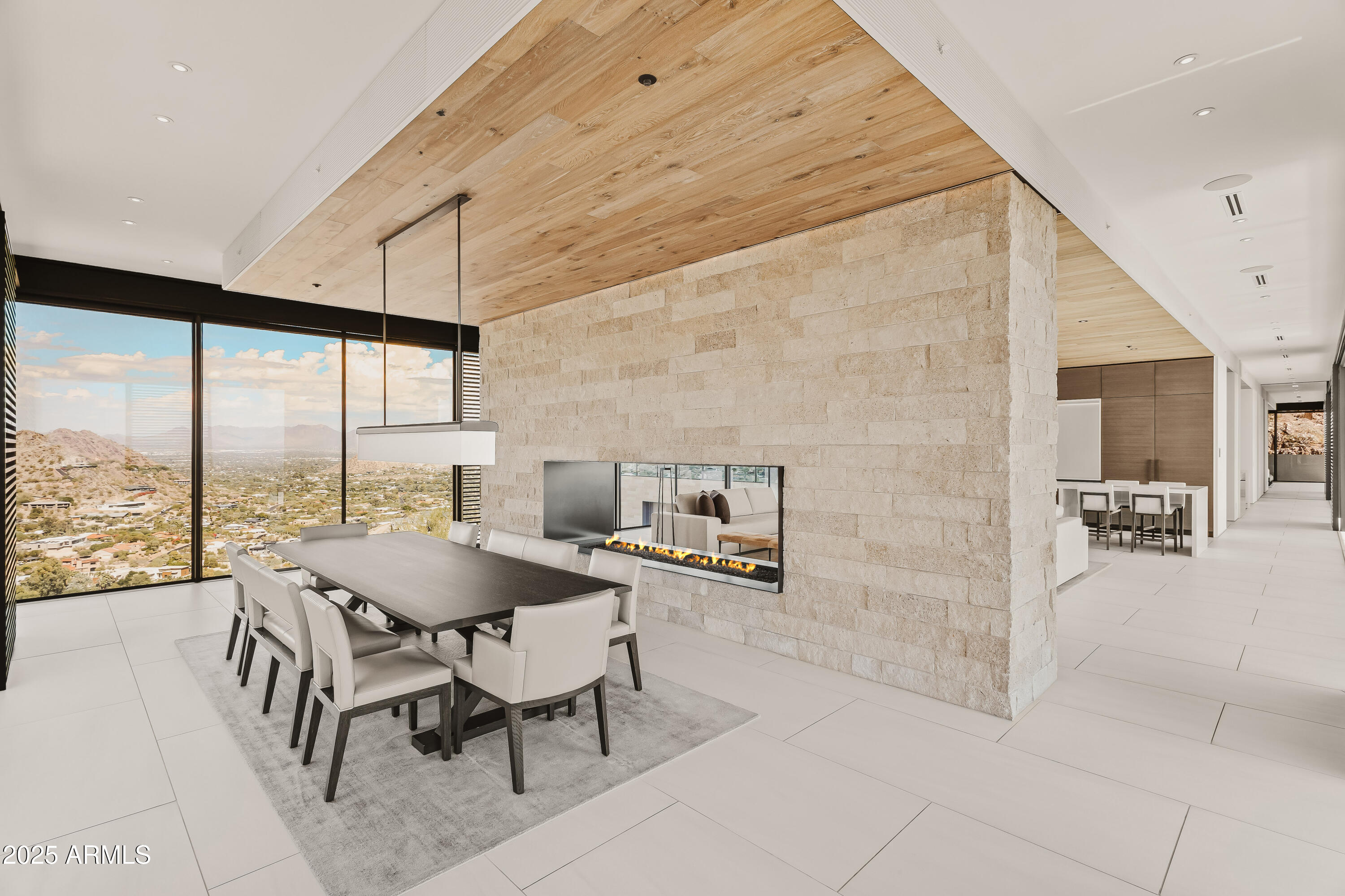 4301 East Upper Ridge Way Paradise Valley, AZ 85253 - Photo 12 of 53 a dining room with furniture and a floor to ceiling window