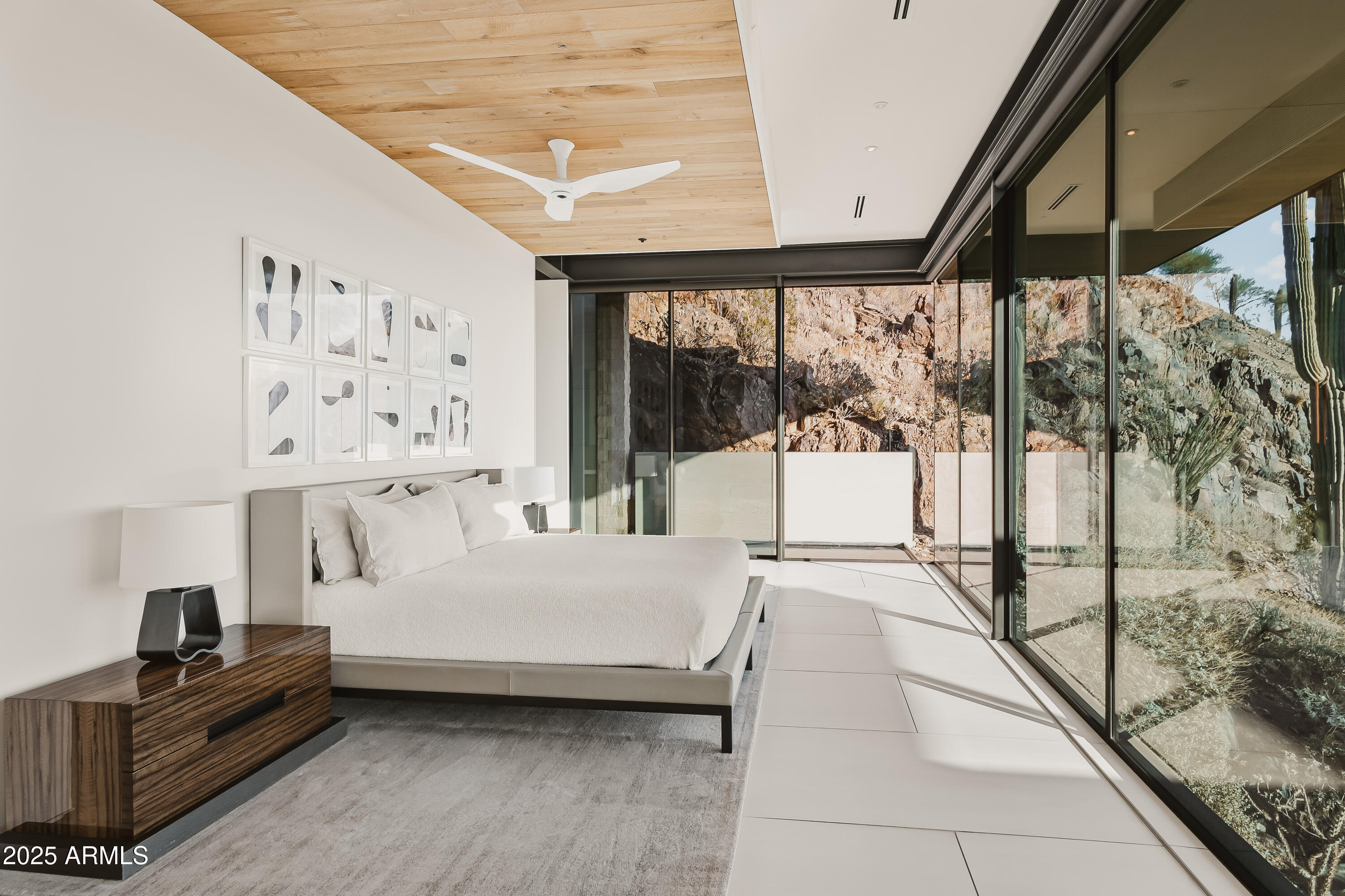 4301 East Upper Ridge Way Paradise Valley, AZ 85253 - Photo 16 of 53 a bedroom with a bed and a large window with balcony view