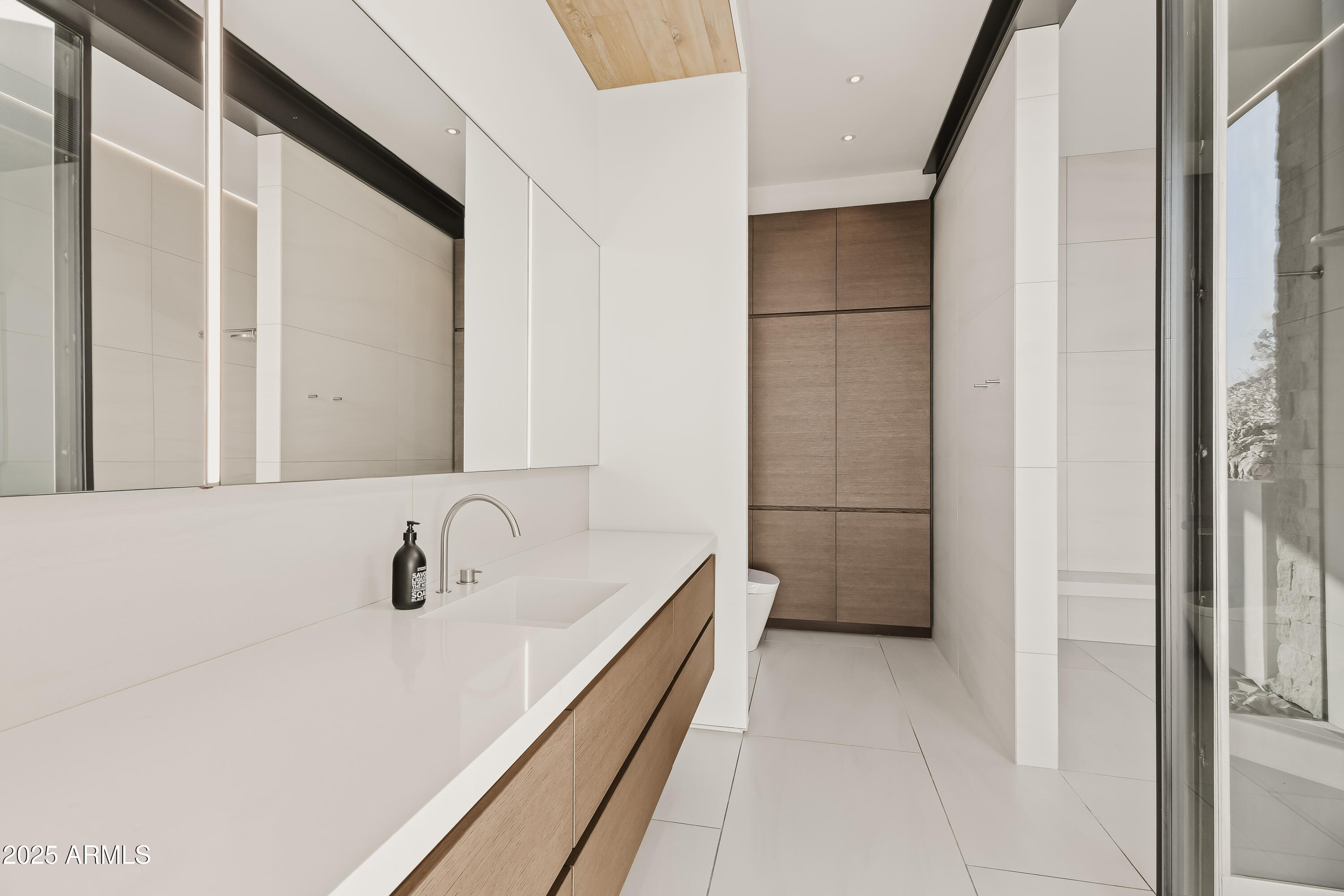 4301 East Upper Ridge Way Paradise Valley, AZ 85253 - Photo 20 of 53 a bathroom with a sink and a mirror