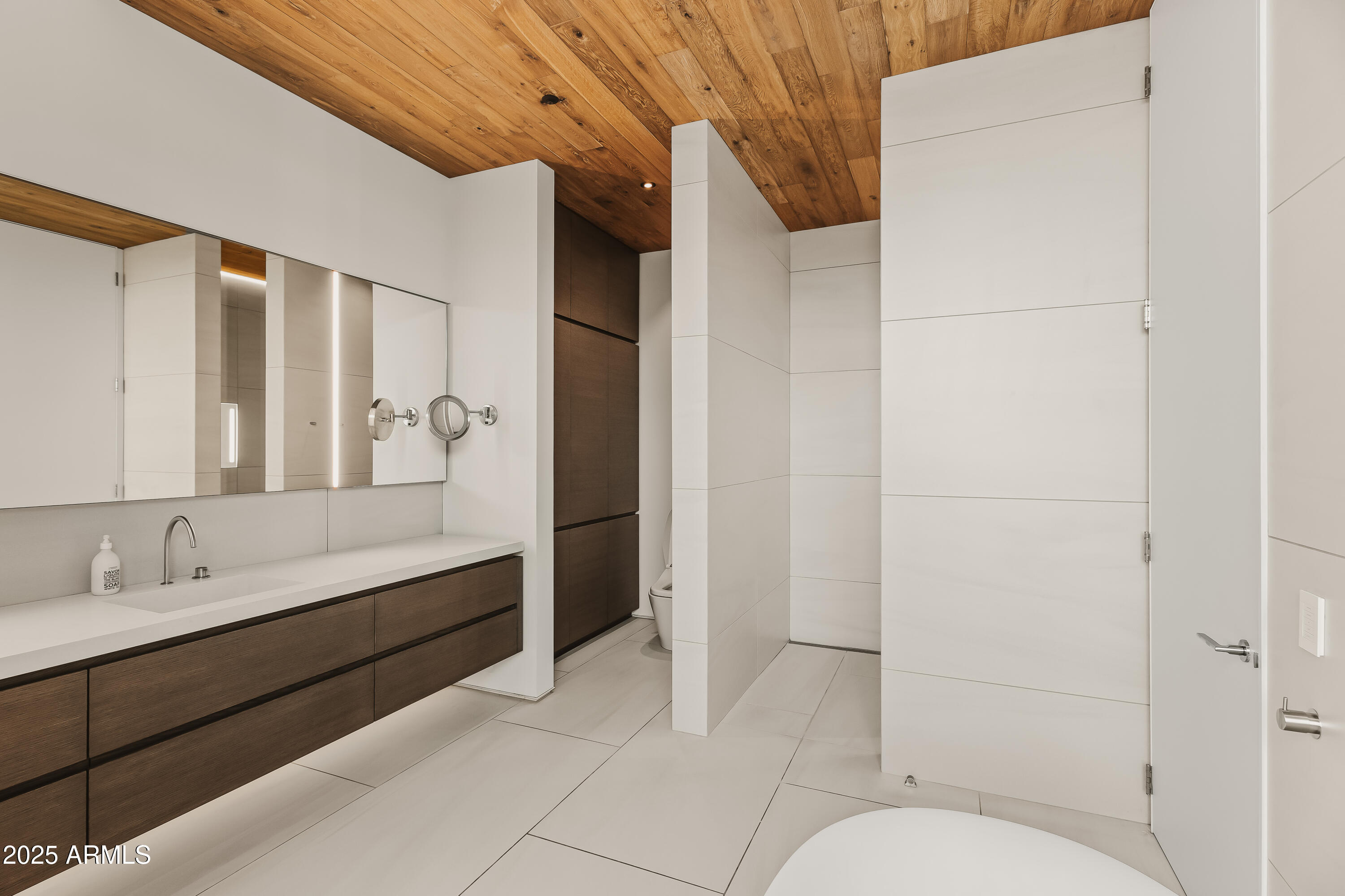 4301 East Upper Ridge Way Paradise Valley, AZ 85253 - Photo 23 of 53 a bathroom with a sink and mirror