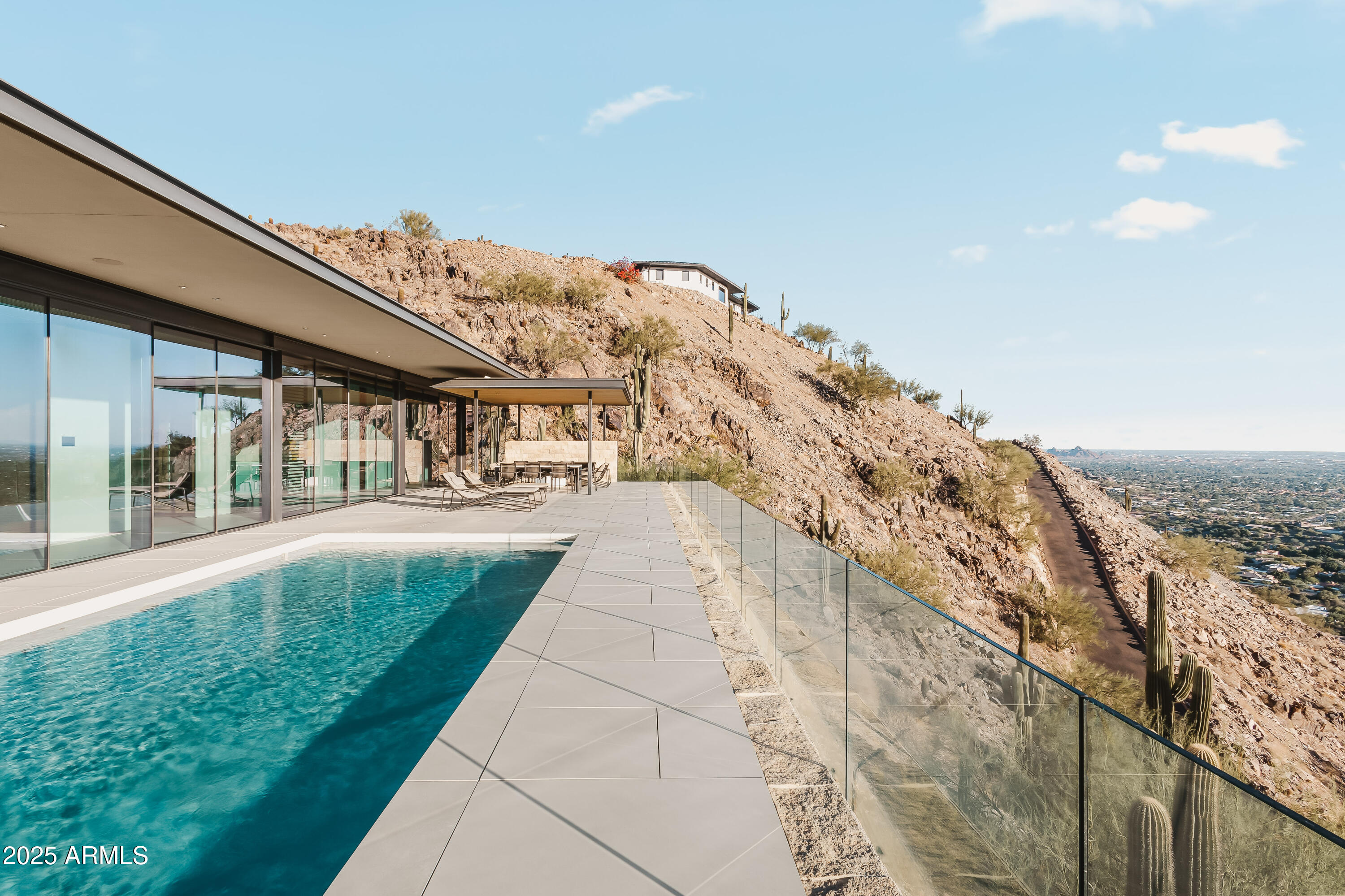 4301 East Upper Ridge Way Paradise Valley, AZ 85253 - Photo 39 of 53 a view of a swimming pool with an outdoor seating