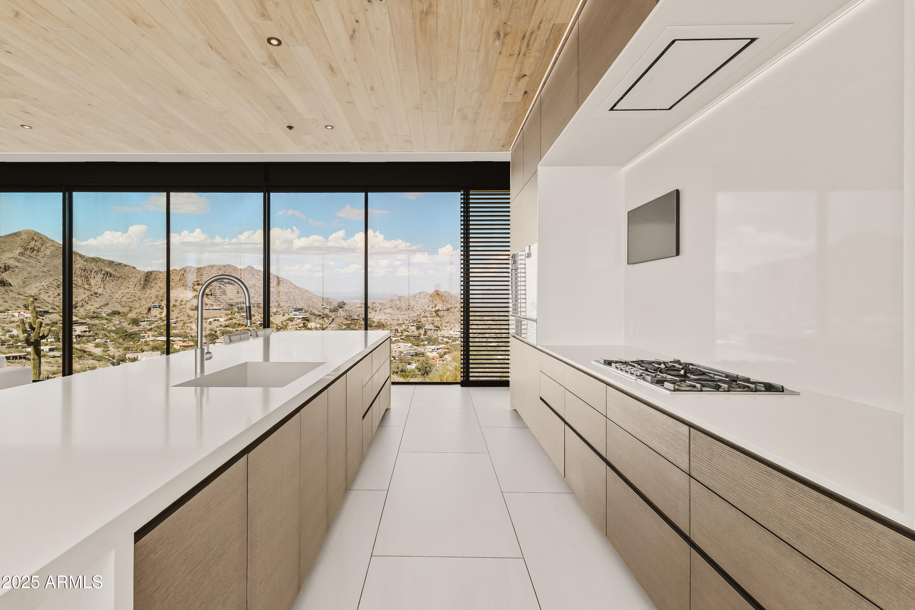 4301 East Upper Ridge Way Paradise Valley, AZ 85253 - Photo 8 of 53 a large white kitchen with a large window