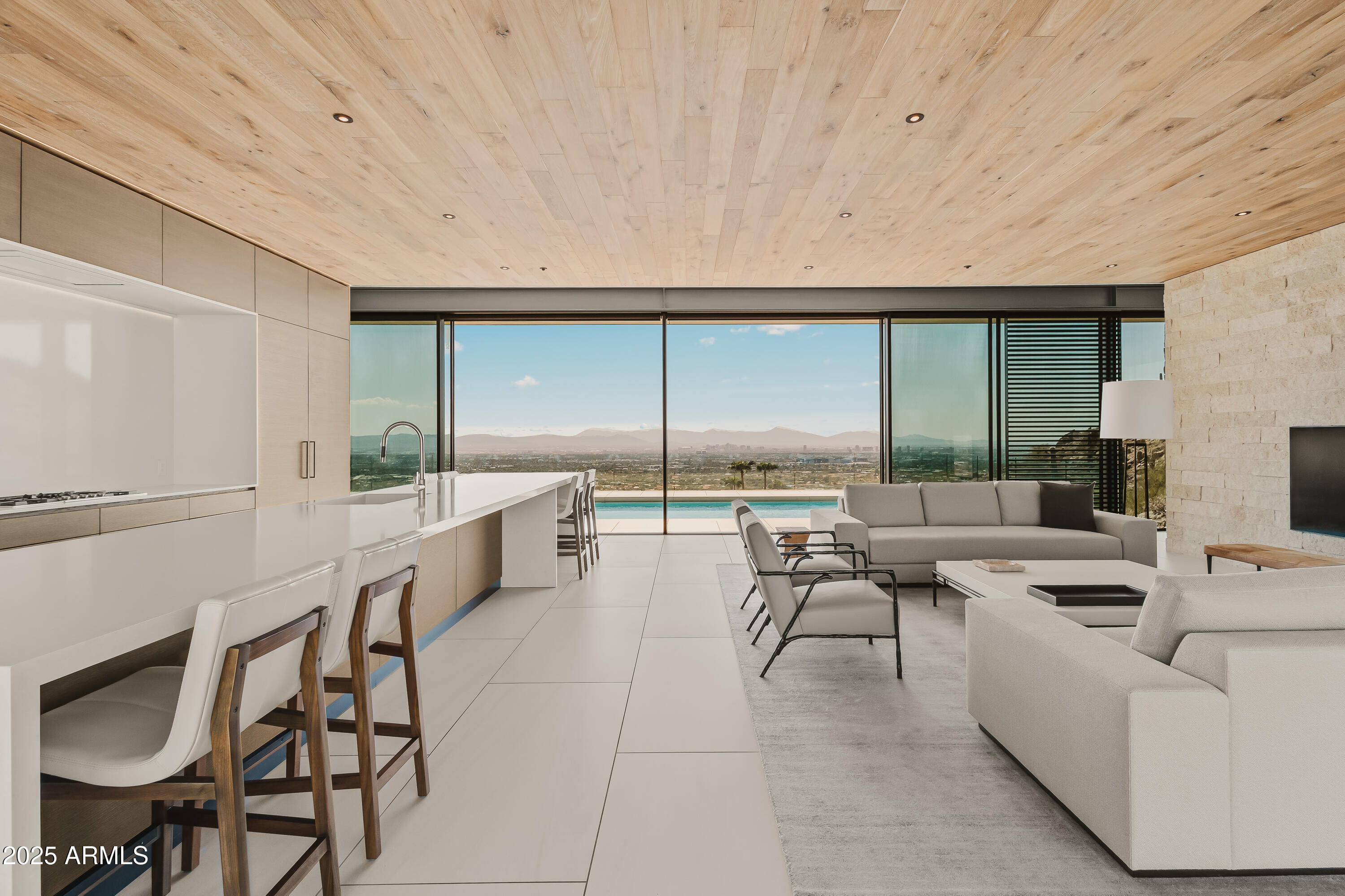 4301 East Upper Ridge Way Paradise Valley, AZ 85253 - Photo 9 of 53 a living room with furniture a large window and stainless steel appliances