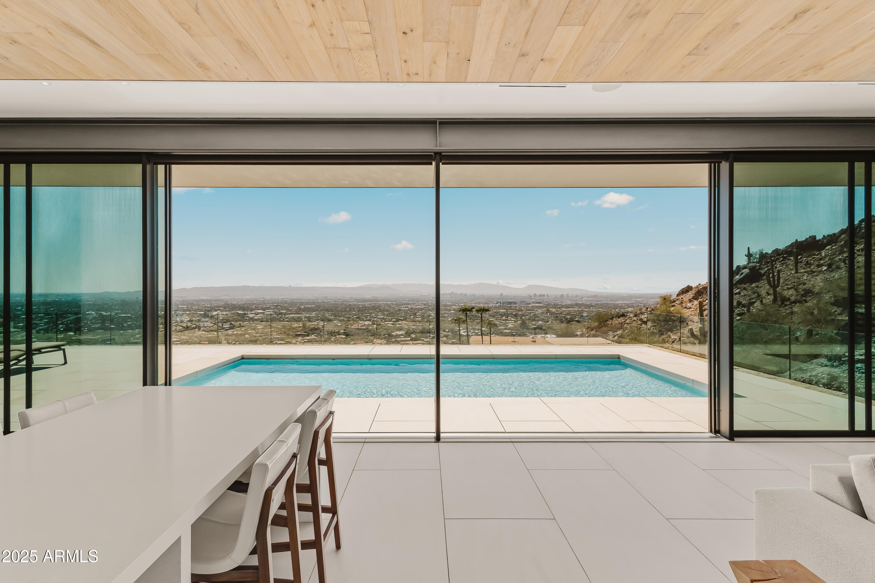 4301 East Upper Ridge Way Paradise Valley, AZ 85253 - Photo 10 of 53 a view of a living room and floor to ceiling window