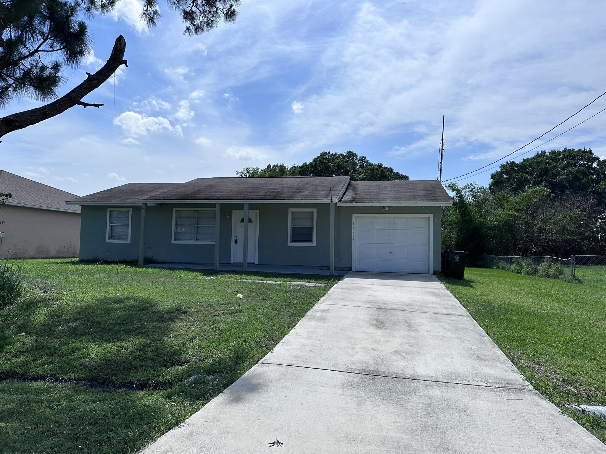 1962 Southwest Capri Street Port St. Lucie, FL 34953 - Photo 1 of 26 Front
