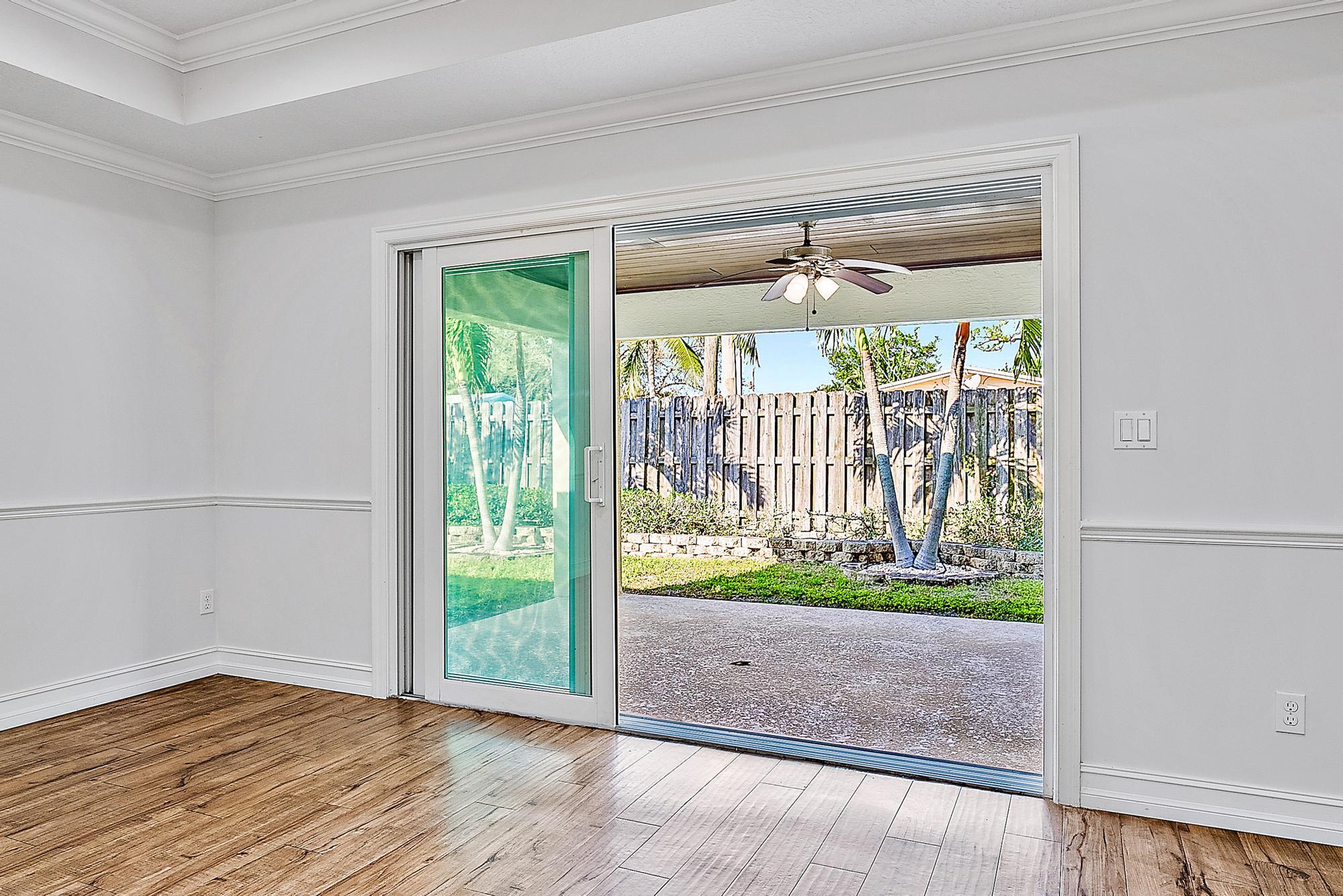 5791 Roebuck Road Jupiter, FL 33458 - Photo 11 of 23 Pocket Doors to Patio