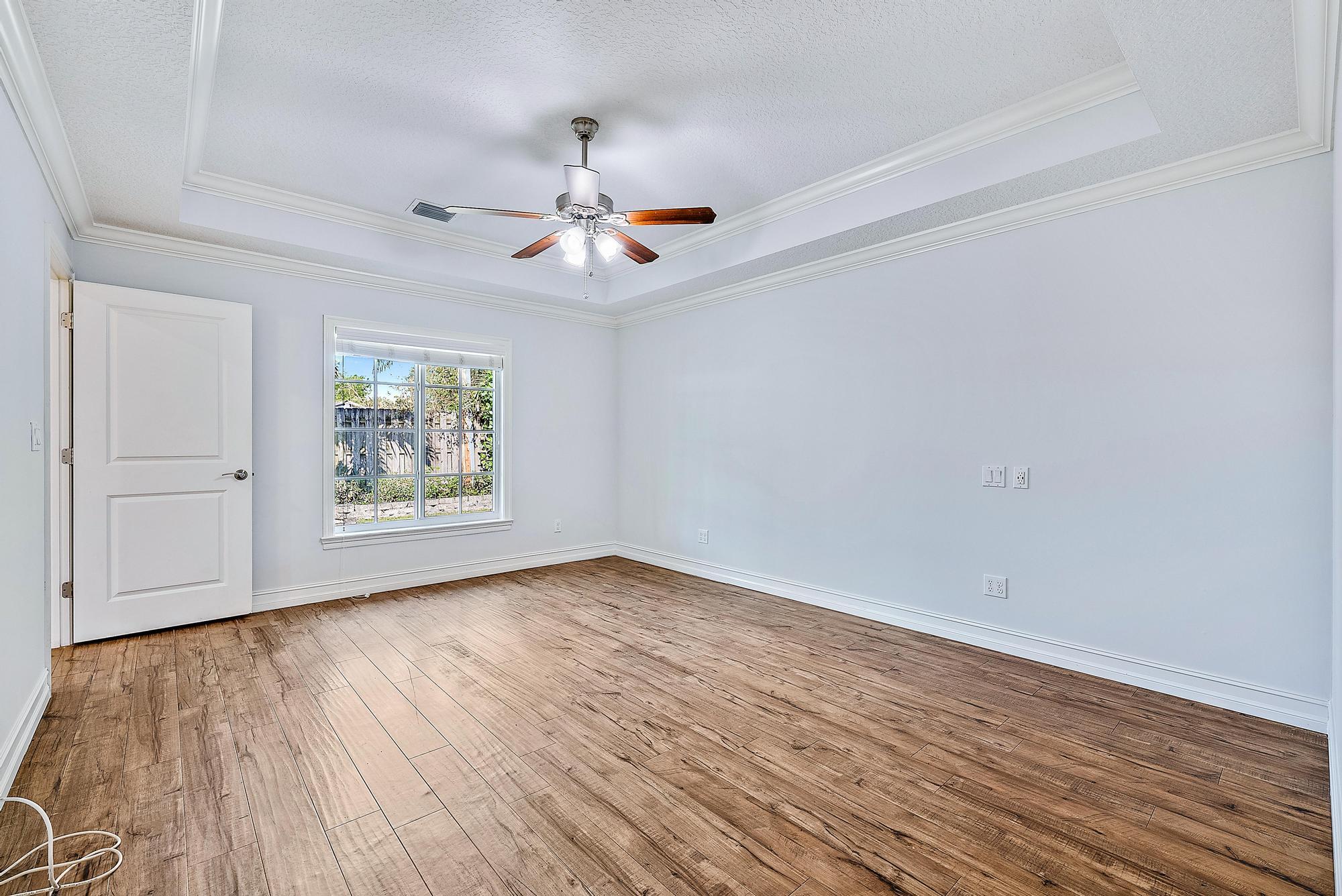 5791 Roebuck Road Jupiter, FL 33458 - Photo 13 of 23 Primary Bedroom