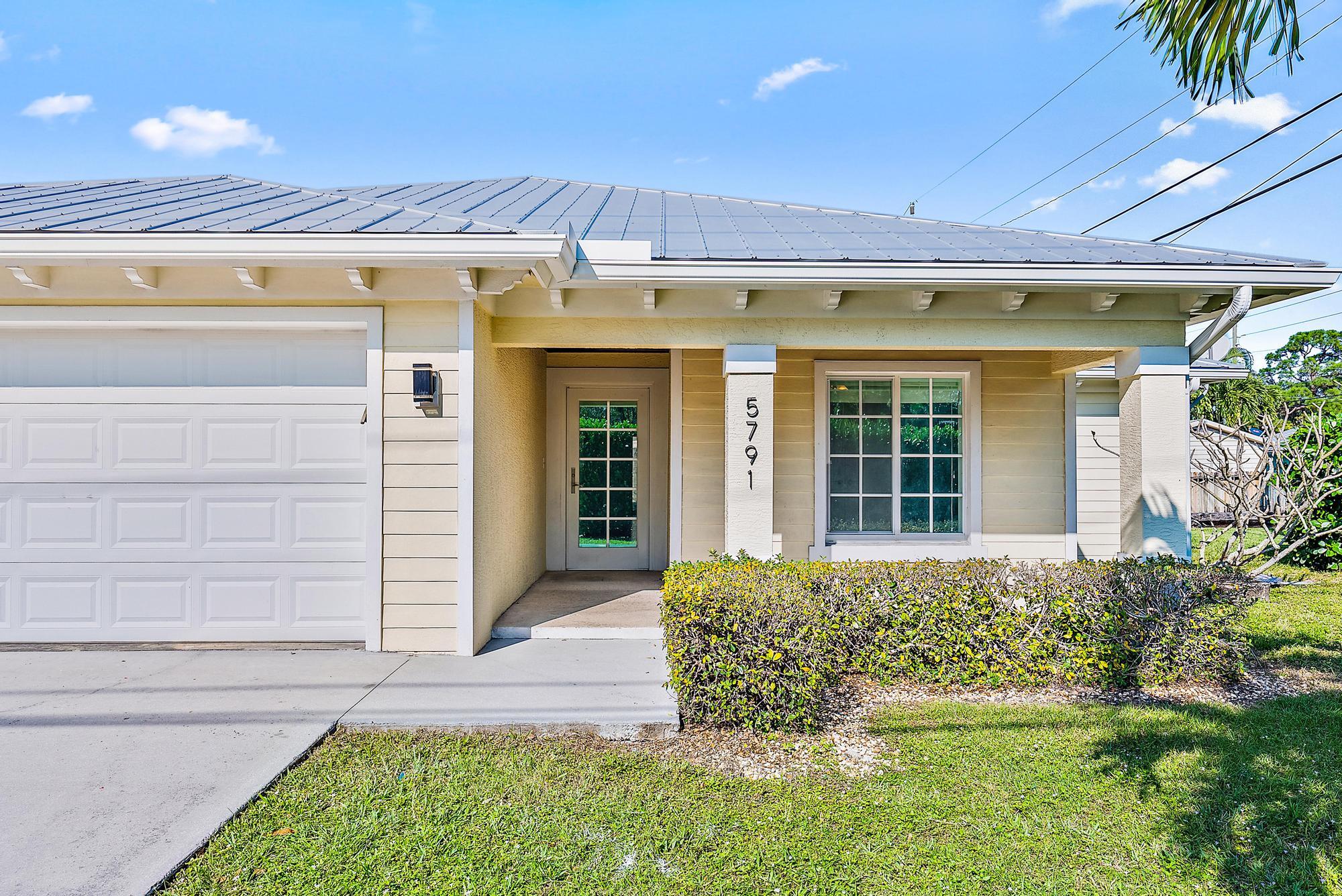 5791 Roebuck Road Jupiter, FL 33458 - Photo 3 of 23 Front