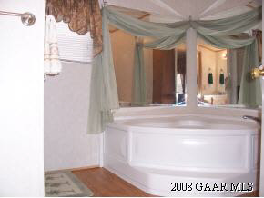 360 Steeles Fort Road Raphine, VA 24472 - Photo 2 of 10 a bathroom with a sink and a mirror