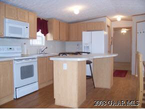 360 Steeles Fort Road Raphine, VA 24472 - Photo 4 of 10 a kitchen with a sink a stove a refrigerator and cabinets