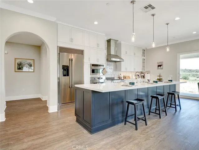 a kitchen with lots of counter top space and appliances