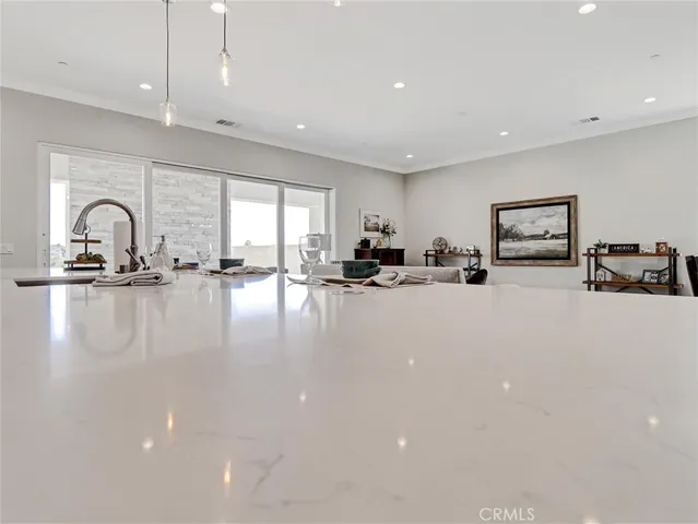 a kitchen with stainless steel appliances white cabinets and a sink