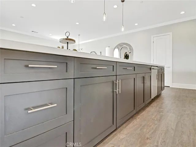 a kitchen with a stove and cabinets