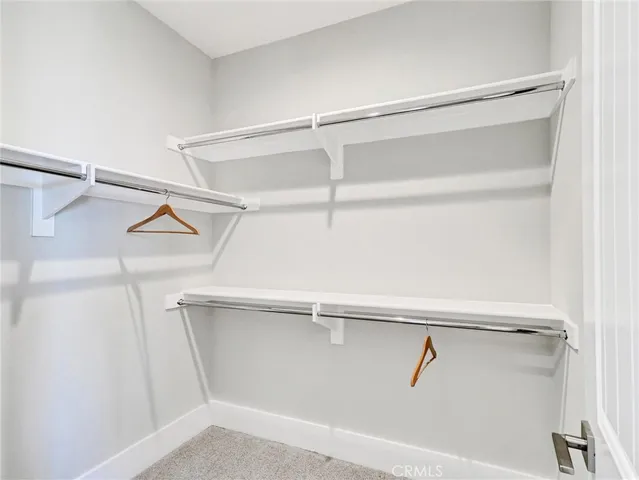 a bathroom with double vanity sinks and a mirror