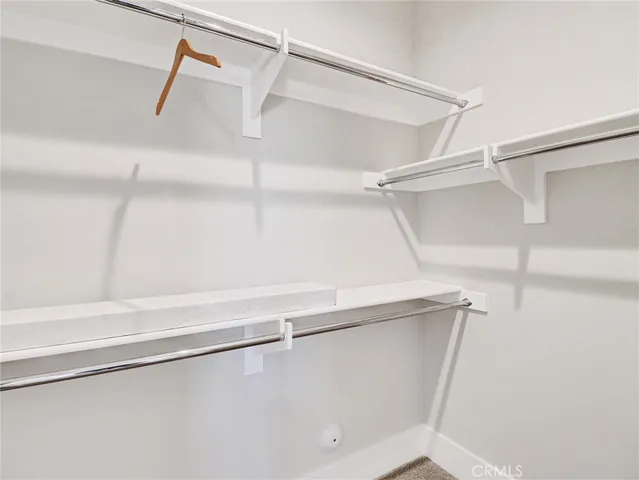 a bathroom with a tub shower and window