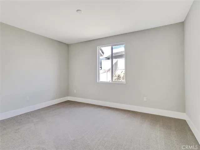 a living room with couches chairs and a fireplace