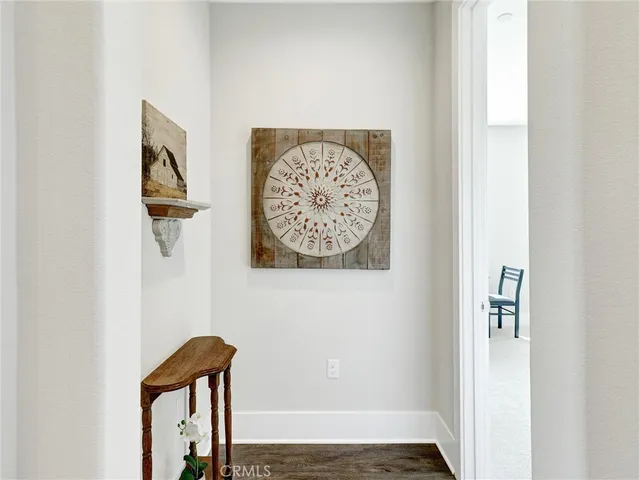a view of a hallway with paintings on the wall