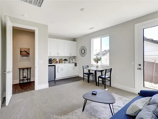 a view of a livingroom with furniture and window