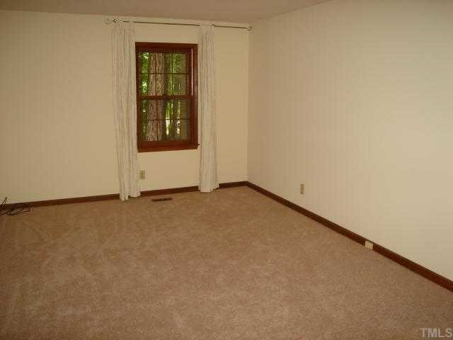 1117 Twyla Road Cary, NC 27519 - Photo 7 of 12 Master bedroom with new carpeting, walk-in closet, and bath