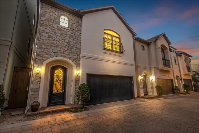 a view of building with glass windows and door
