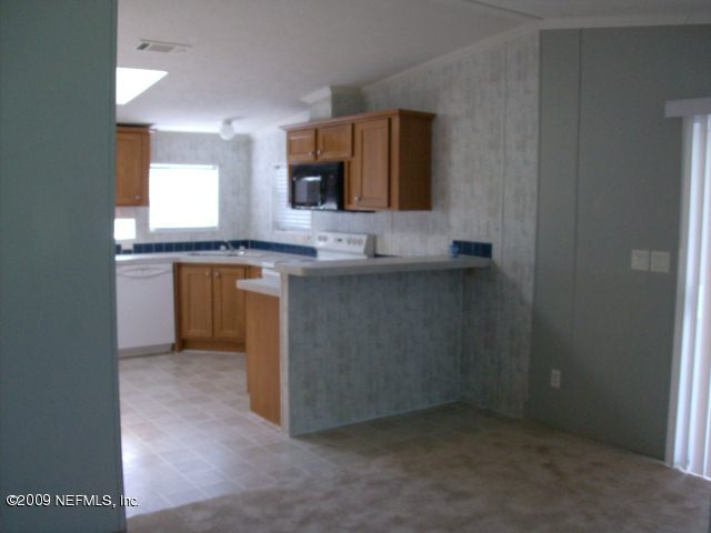 3636 Loango Road Orange Park, FL 32065 - Photo 3 of 13 a bathroom with a sink and a mirror