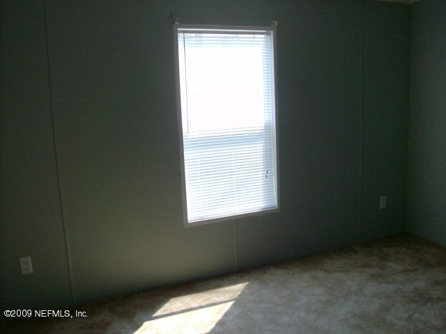 3636 Loango Road Orange Park, FL 32065 - Photo 7 of 13 a view of an empty room with a window