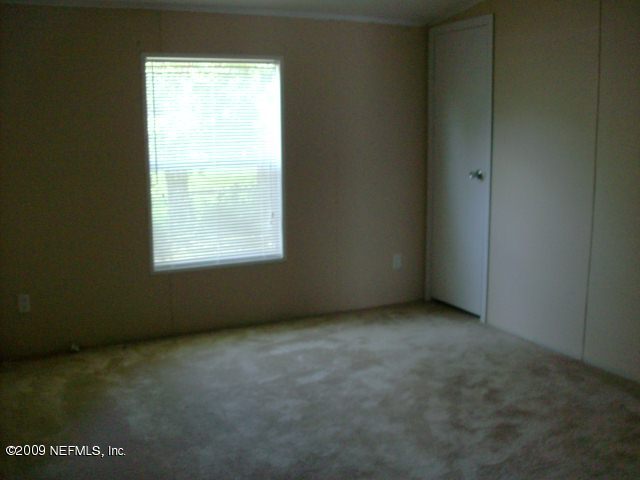 3636 Loango Road Orange Park, FL 32065 - Photo 8 of 13 an empty room with a window