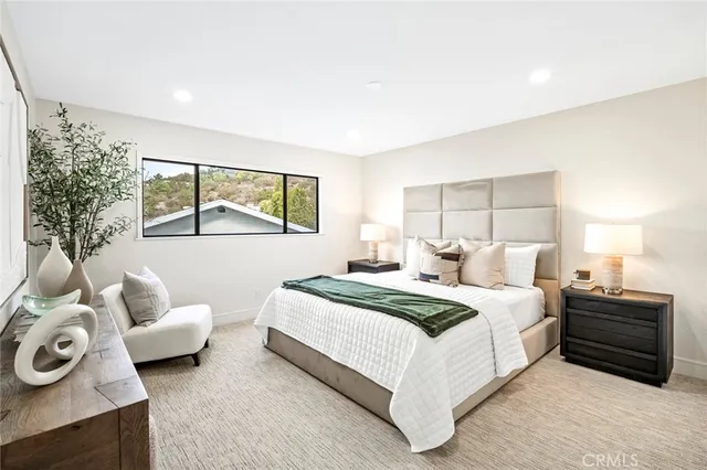 a bedroom with a bed and a couch