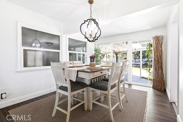 4866 Sunnyside Drive Riverside, CA 92506 - Photo 15 of 29 a view of a dining room with furniture window and wooden floor