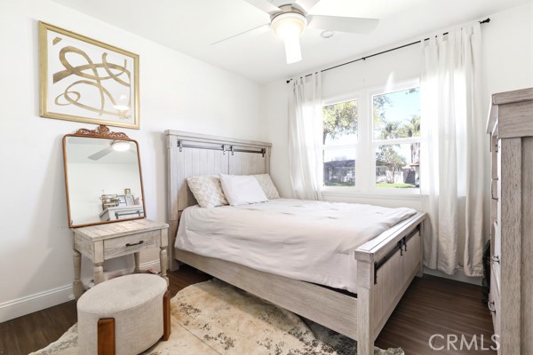 4866 Sunnyside Drive Riverside, CA 92506 - Photo 17 of 29 a bedroom with a bed and a painting on the wall