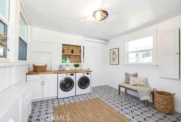 4866 Sunnyside Drive Riverside, CA 92506 - Photo 23 of 29 a living room with a couch and a table in it