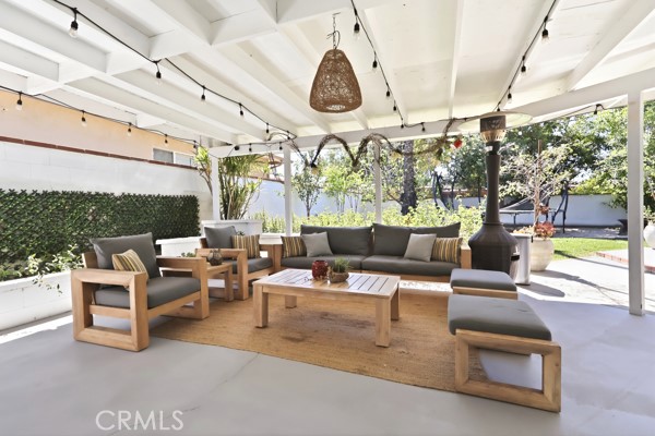 4866 Sunnyside Drive Riverside, CA 92506 - Photo 25 of 29 a living room with patio furniture and a large window