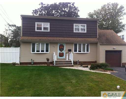 59 Middle Hill Road Colonia, NJ 07067 - Photo 1 of 25 a front view of a house with a yard