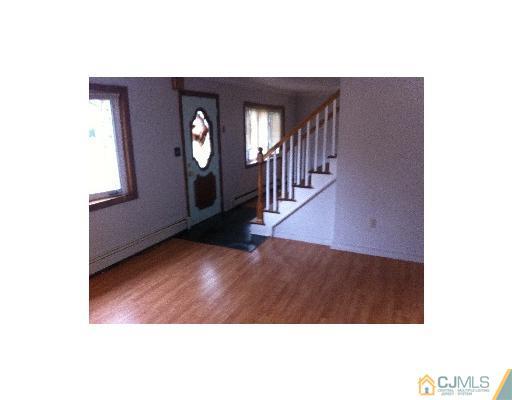 59 Middle Hill Road Colonia, NJ 07067 - Photo 5 of 25 a view interior of a house with wooden floor